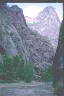 Photo of a V-shaped valley, The Narrows, Zion National Park in Utah. The Virgin River flows through The Narrows, widening and deepening the canyon.