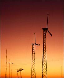 Photograph of a water-pumping windmill and an electricity-generating wind turbine.