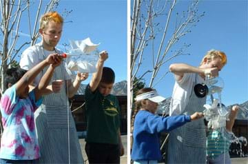 Two photos show students on a playground holding their waterwheels as water is poured over the waterwheels.