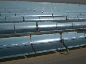 Photo showing many rows of curved, silver collectors.
