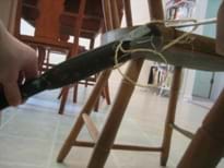 This is a side view of the hammer pulled back until it hits the wall.