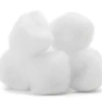 A close-up image of five cotton balls.
