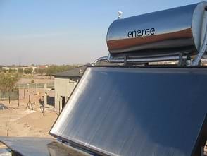 A close-coupled thermosiphon solar water heater mounted on a roof.