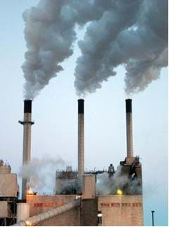 A photograph of a coal electric power plant Shown are three smoke stacks that have huge plumes of greenhouse gas (sulpher and mercury) emissions.