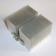 A photograph shows a metal device that looks like about 50 thin square metal pieces lined up next to each other but not touching, like a mini radiator.