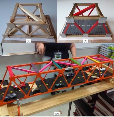 Truss bridge reinforced with braces, finished with a deck, and decorated.