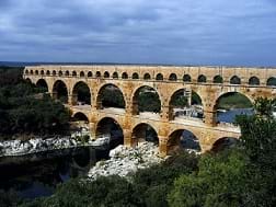 A photograph shows the Pont du Gard, a double-high, multi-arched long structure—an ancient aqueduct.
