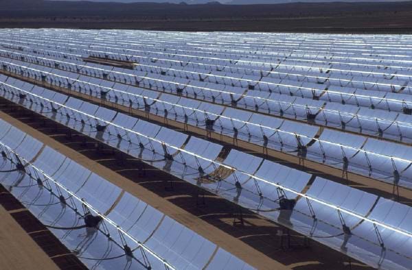 Rooftop of silver, curved solar collectors. Rooftop of silver, curved solar collectors.