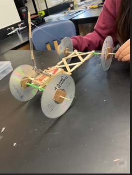 Student-designed examples of the Mouse Trap Car Design Challenge activity.