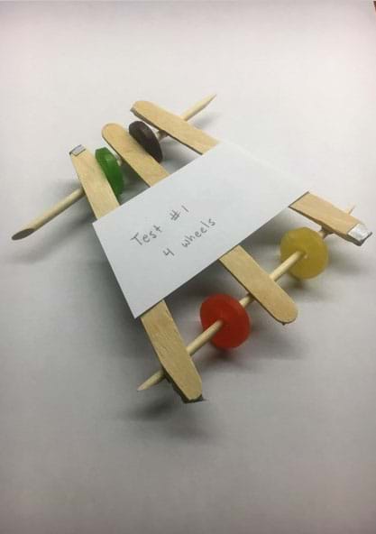 An example of a mint-mobile made with popsicle sticks, dowels, and round mints.