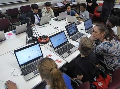 10 children plus volunteer helpers all busily working through projects in Tinkercad getting ready for 3D printing.