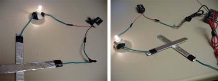 Two photos: (left) Wires connect an aluminum-foil covered paddle to a miniature light bulb in a socket, wired to a 9-volt battery, wired to a second electrode. (right) The same setup, except with a multimeter added between the battery and second electrode.