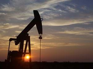 A photograph shows a pumpjack used in an oil well in Texas.