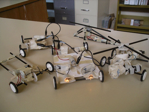 Photo shows five examples of toys constructed by students.