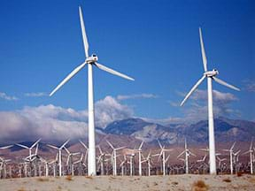 A close up of wind turbines at a wind farm.