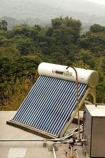 A solar water heater mounted on a roof.
