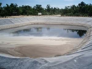 A pond used for leachate evaporation to become a municipal landfill.