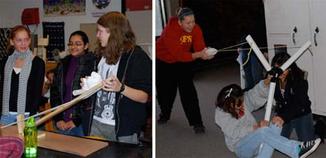 Two photos: (left) Three girls test their catapult made from wooden boards, PVC pipes, a hinge and string. (right) A girl pulls back on a wadded-up t-shirt using a giant slingshot made of PVC piping.