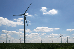 A landscape photograph shows a field of tall wind turbines in northwestern Benton County, IN.