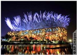 A photograph shows fireworks exploding over the 2008 Olympics stadium that resembles a giant bird's nest.