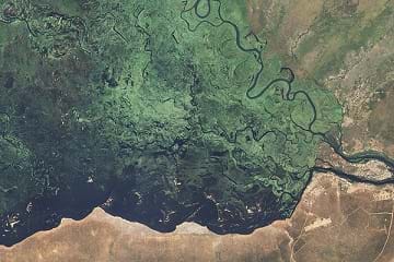 A detailed true-color image showing the stark eastern edge of the Zambezi floodplain. 