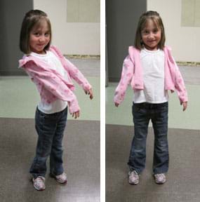 Two photos of a smiling young girl: (left) Holding her arms out in front of her as far as she can — about 30° from her body. (right) Holding her straight arms out to the sides of her body as far as she can — about 15° from her sides.