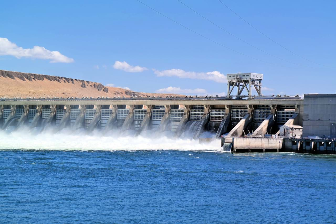 Hydroelectric dam with water going through gates.