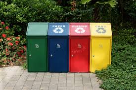 Colorful recycling trash containers for recycling and disposal of waste.