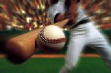 A baseball player hitting the ball with a bat during the 1993 playoff game, Phillies vs. Braves. 