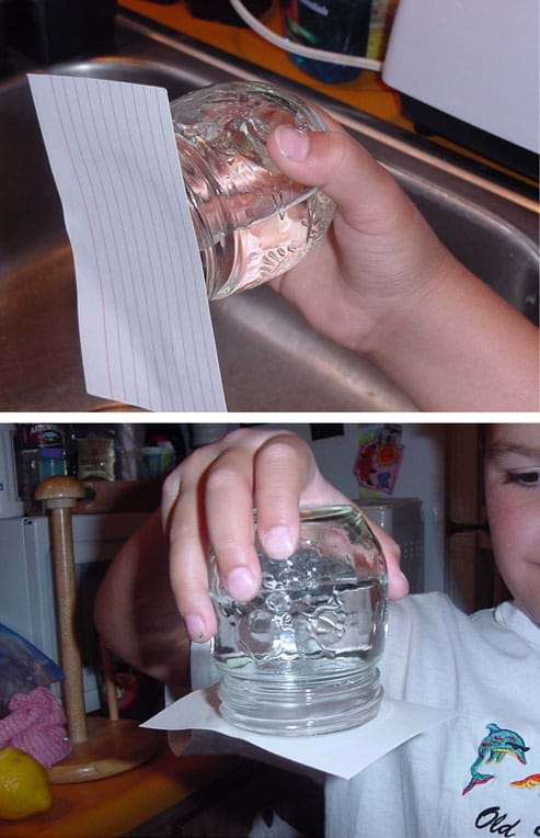 Photographs showing an index card securely fastened on the top of an upside down and horizontal jar filled with water.