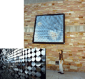View of the shiny wall sculpture from a distance, and up close, to see the discs.