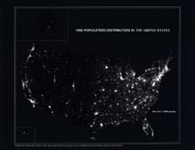 Night-time, mostly black satellite image of the U.S. with white light visible from populated areas.