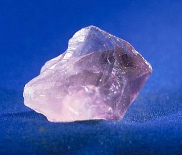 A translucent purple amethyst crystal.