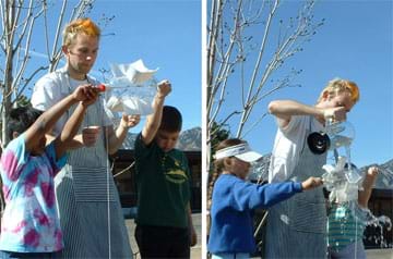 Two photographs show students on a playground holding their waterwheels as water is poured over the waterwheels.