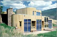 Photo showing south-facing windows of a modern family home.