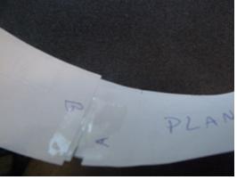 Photo shows a strip of paper with side A taped to strip side B after it was twisted one-half turn.