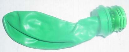 A photograph shows an un-inflated green balloon with its neck stretched over the cut edge of a plastic bottle top, leaving the screw-top edge exposed.