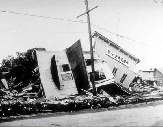 Photo shows two buildings almost completely collapsed.