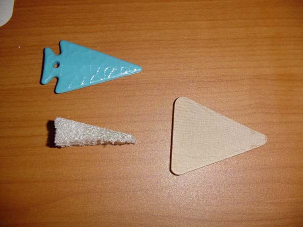 Photograph of three triangular-shaped items. 