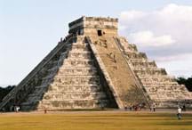 Photo shows a huge stone pyramid with many steps and a flat top.