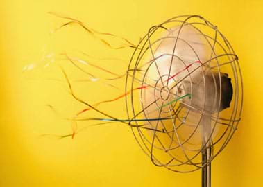 Photo shows fluttering ribbons tied to a spinning fan.