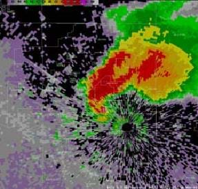 A computer simulation image of the radar reflectivity image of a tornado looks like concentric swirls of red, orange, yellow and green on a dark map.