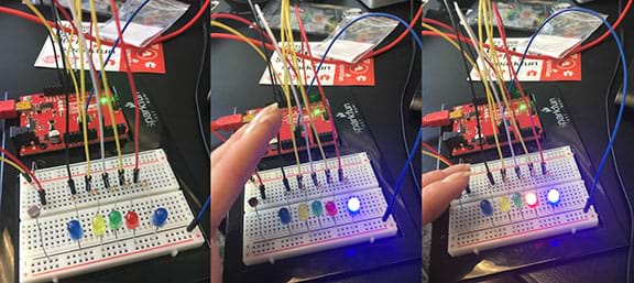 Three photos show the same circuit setup composed of a breadboard with five LEDs and a photocell connected to a RedBoard to show three conditions and the LED results (left to right): no darkness (all LEDs off), slight darkness (one LED on) and more darkness (two LEDs on). 