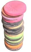 A photograph of a stack of different colored round candy wafers.