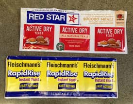 A photograph shows six packets of active dry yeast, two brands: Red Star and Fleischmann's.