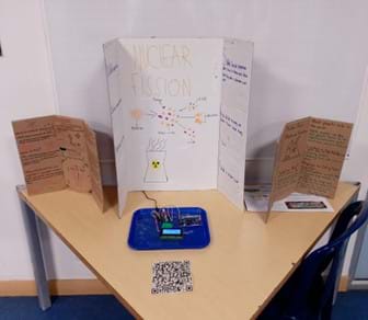 A photo showing a final stand with functioning Geiger counter and trifold posters.