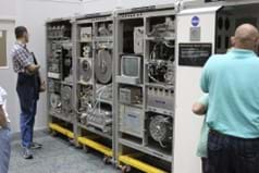 A photo showing visitors viewing a water recovery system like the one used on the ISS that is on display at the Marshall Space Flight Center. A photo showing visitors viewing a water recovery system like the one used on the ISS that is on display at the Marshall Space Flight Center.