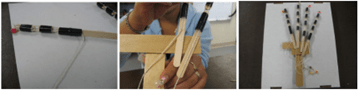 Side-by-side photos of a finished finger with pull-string attached on the left, fingers being affixed to a popsicle stick palm in the middle, and five completed fingers attached to a flat board, forming a full hand prototype, on the right. Side-by-side photos of a finished finger with pull-string attached on the left, fingers being affixed to a popsicle stick palm in the middle, and five completed fingers attached to a flat board, forming a full hand prototype, on the right.