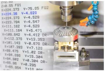 An image of a machining tool superimposed over several lines of G-code.
