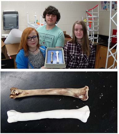 Two photographs: Three students hold a tray that contains two bones—a real turkey femur (~8 inches long) and their prototype 3D-printed replica bone. A close-up of the two bones in the tray; the 3D printed bone looks similar to the real turkey but whiter.